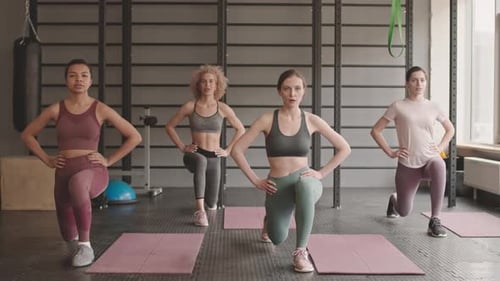 Women Doing Lunges at the Gym
