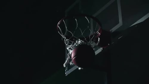 Basketball Scores in Hoop at Night in Slow Motion
