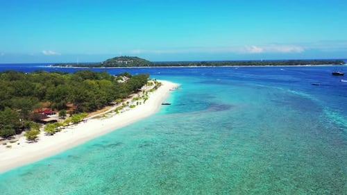 Daytime aerial abstract shot of a white paradise beach and aqua blue water background in 4K
