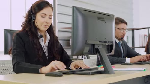 Business People Wearing Headset Working in Office