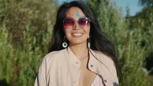 Smiling Woman Covered in Holi Festival Powder