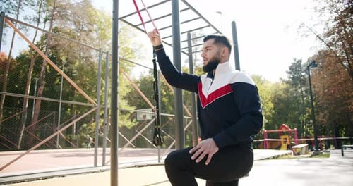 Man Working Out With Resistance Bands Outdoors