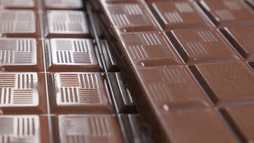 Dark chocolate block details slow close-up tilting 4K 2160p 30fps UltraHD video - Perspective made