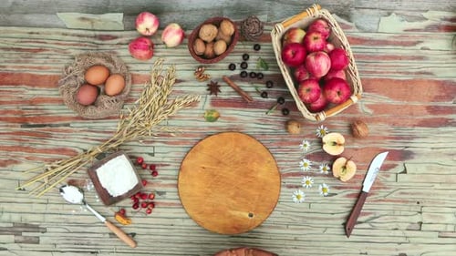 Apple Pie Ingredients Arranged with Pie on Wood Table