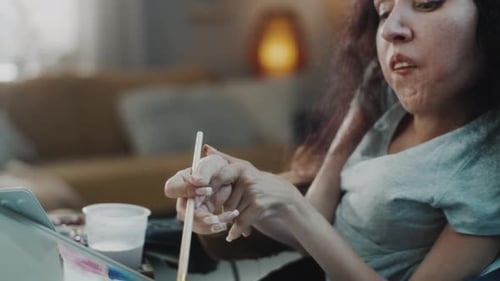 Woman Painting on Canvas with Assistance