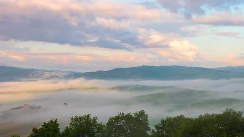 Time lapse of the morning fog and clouds in Tuscany Italy