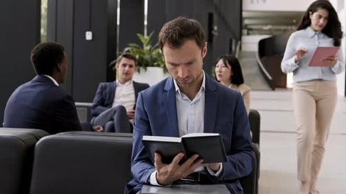 Business People Waiting in Corporate Office Lobby