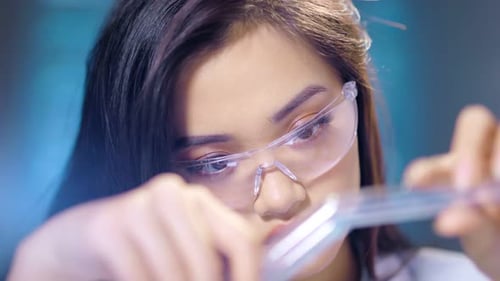 Woman Scientist Working with Test Tubes in Lab