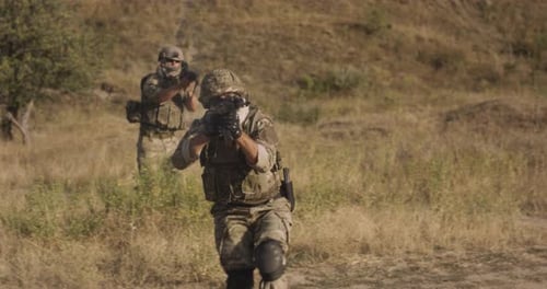 Anonymous Military Man Aiming Rifle