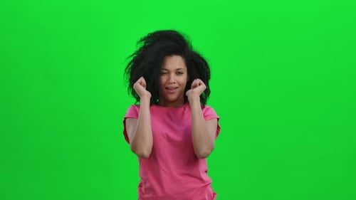 Smiling Woman Giving Thumbs Up on Green Screen