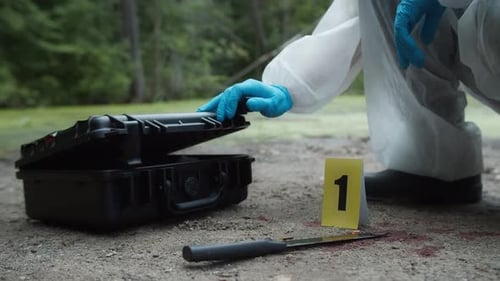 Crime Scene Investigator Collects Evidence