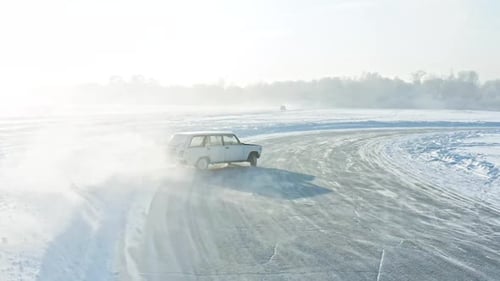 Car Drifting on Icy Track in Winter Scene