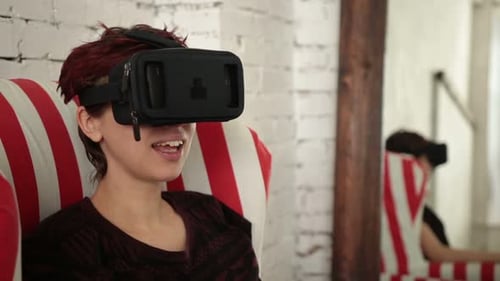 Woman Using Virtual Reality Headset at Home