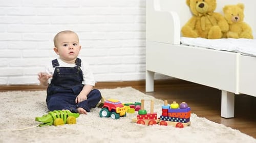 Cute Infant Sitting with Toys on Carpet