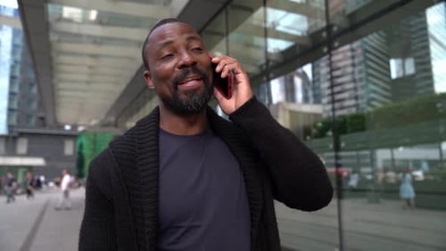 Man Talking on Cell Phone in Urban Setting