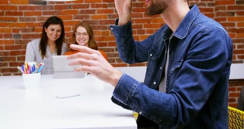 Man Experiences Virtual Reality in Modern Office