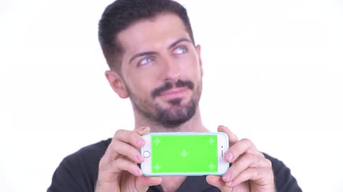 Man Holding Mobile Phone with Green Screen