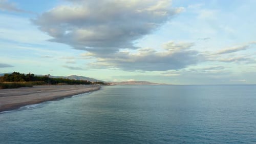 Sandy Coast near the Calm Ocean