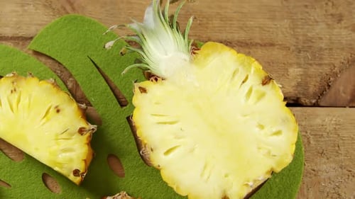 Pineapple Slices on Green Tropical Leaf Decoration