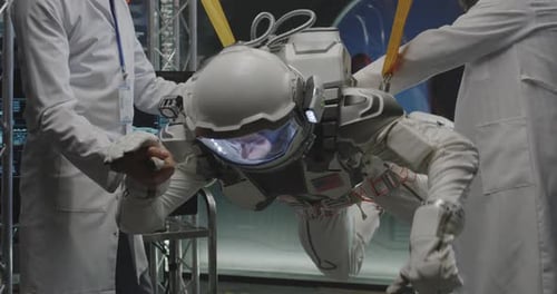 Astronaut Suspended in Spacesuit for Testing