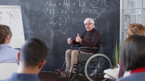 Professor in Wheelchair Teaches Classroom Lecture