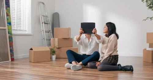 Couple Taking Selfie with Tablet in New Home