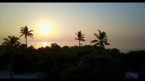Aerial top down scenery of relaxing lagoon beach adventure by blue green water and white sandy backg