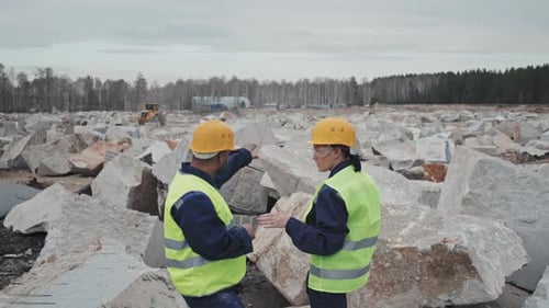 Quarry Workers Having Conversation