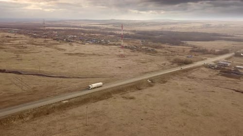 Truck Travels Rural Road in Aerial View