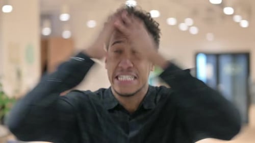 Distressed Man Screams in Frustration