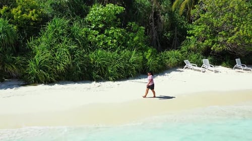 Tourist sunbathing on paradise seashore beach break by blue ocean and white sand background of the M