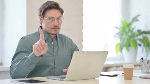 No Gesture with Finger By Middle Aged Man in Office
