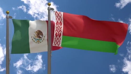 Waving Flags of Mexico and Belarus Under Blue Sky