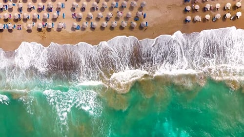 Aerial View of the Sea Sandy Beach Sun Umbrellas and Sunbeds Unrecognizable People