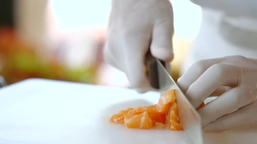Kitchen Knife Cuts Raw Fish.