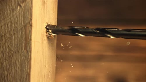 Drill Boring Into Piece of Light Wood