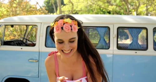 Woman with Flower Crown Smiling at Smartphone