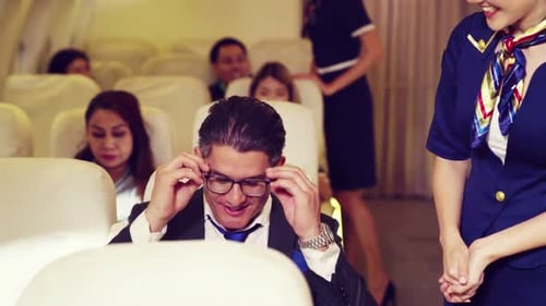 Flight Attendant Giving Sleep Mask to Passenger