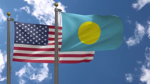United States and Palau National Flags Waving Against Blue Sky