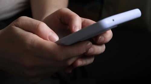Hands Using Mobile Device, Close Up