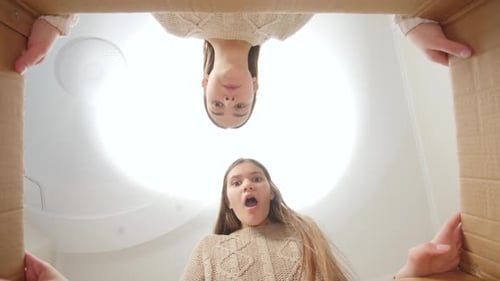 Excited Girl Opening a Birthday Box