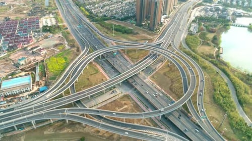 Top View to the Cars Driving on Multilevel Highway on the Sunset