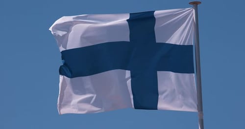 Finnish Flag Waving Against a Blue Sky