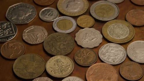 Rotating stock footage shot of international monetary coins - MONEY 0386