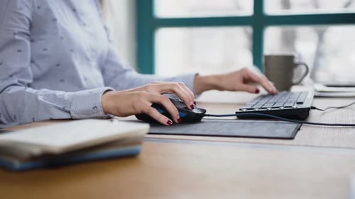Close up Typing on Computer Keyboard at Desk