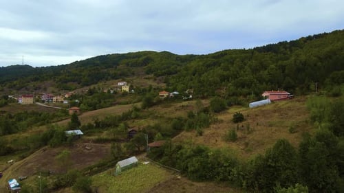 steep green mountains, deep forest and mountain road, beautiful valley and village houses