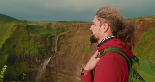 Man with Backpack on a Mountain Overlook