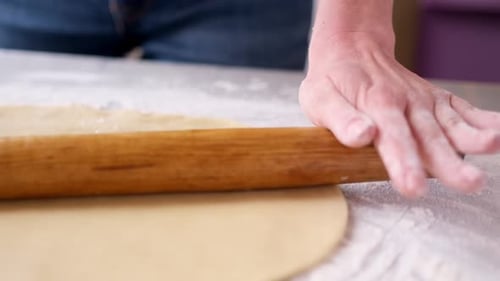 Rolling Dough with Pin for Baking Preparation