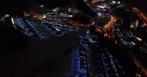 Aerial Forward Mountain Popular Ski Resort Cityscape Modern Houses Among Dark Mountains Tourist