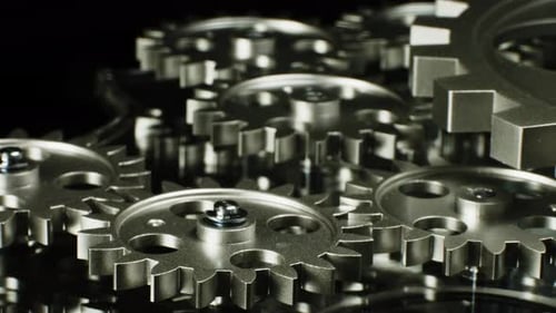 Rotating Silver Gears in a Mechanical Machine
